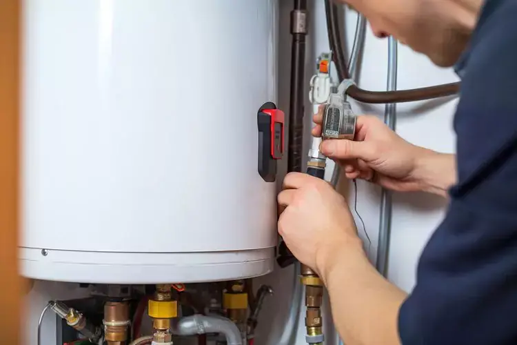 Technician working on a water heater.