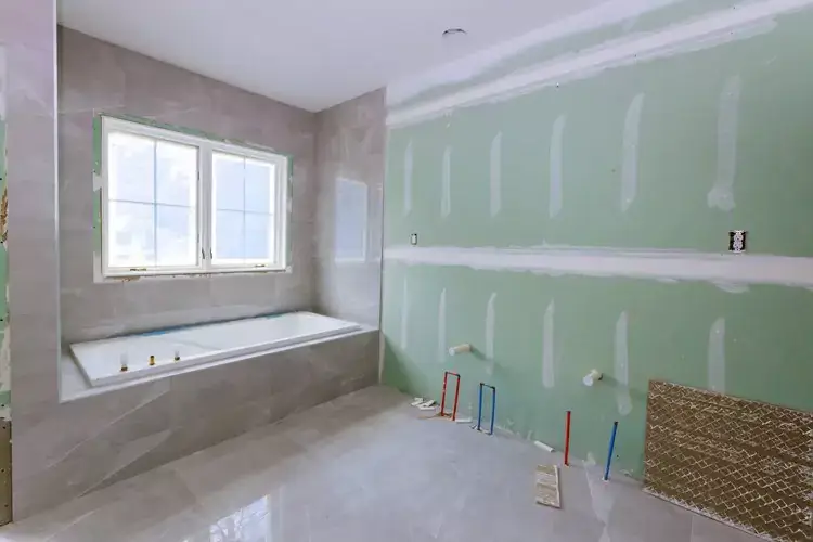 Bathroom renovation with new plumbing fixtures.