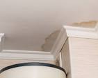 Damp spot on a ceiling indicating a hidden water leak in a San Antonio home